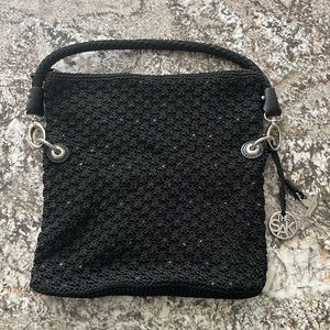 Saks The Sak in black knit material, silver hardware.